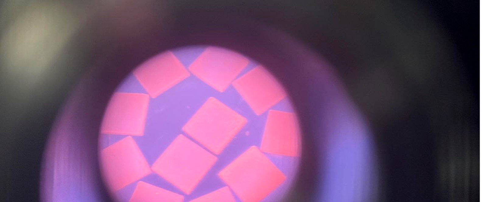 Diamond seed plates glowing incandescent inside a microwave plasma during MPCVD growth